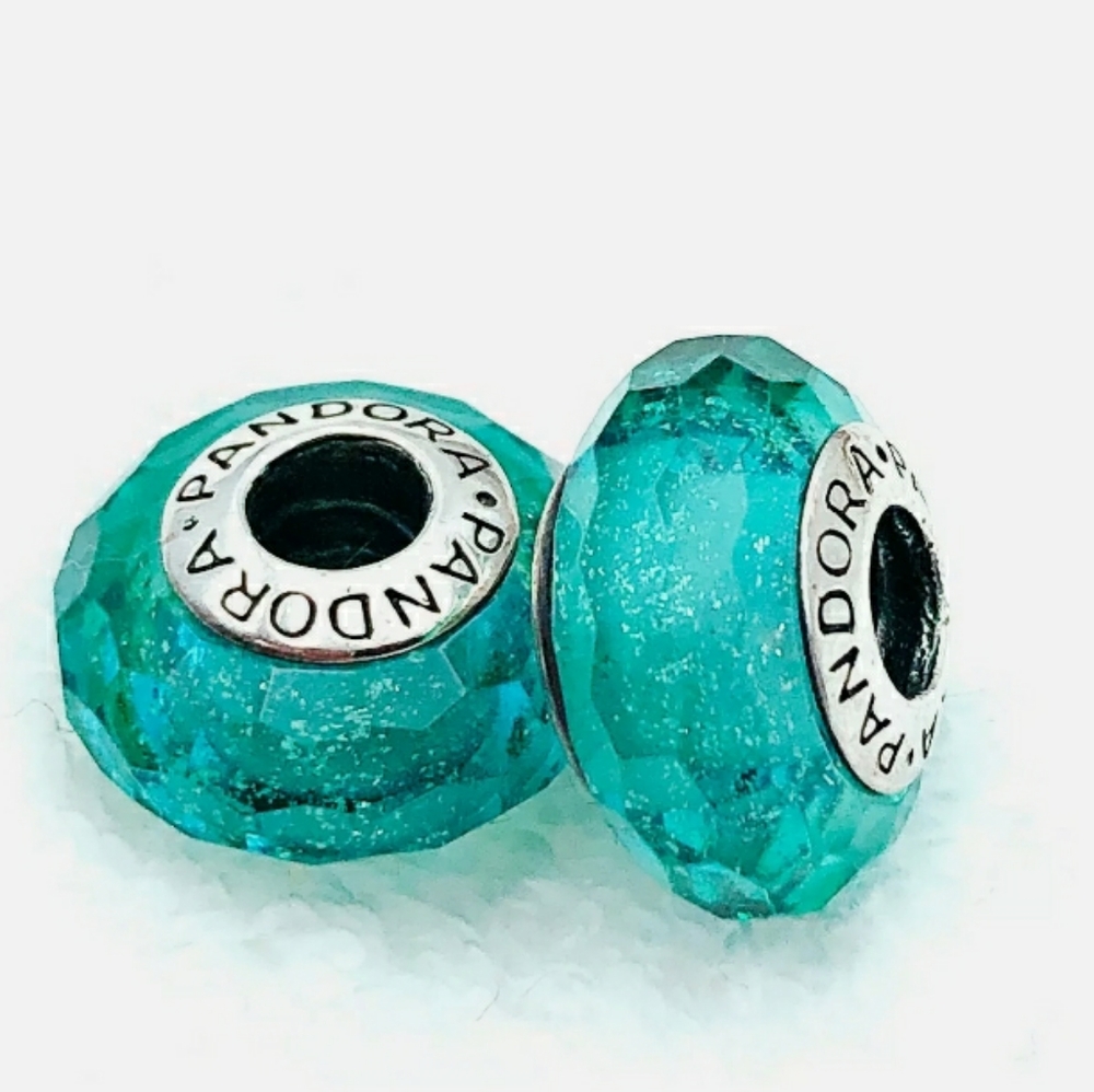 Pandora pair of shimmered faceted teal Muranos.